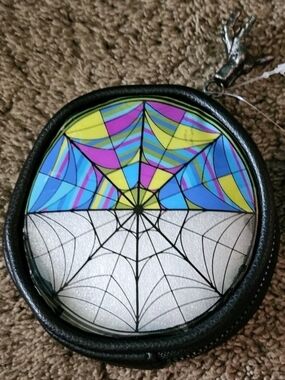Official "Wednesday" coin purse featuring the iconic split-stained-glass window